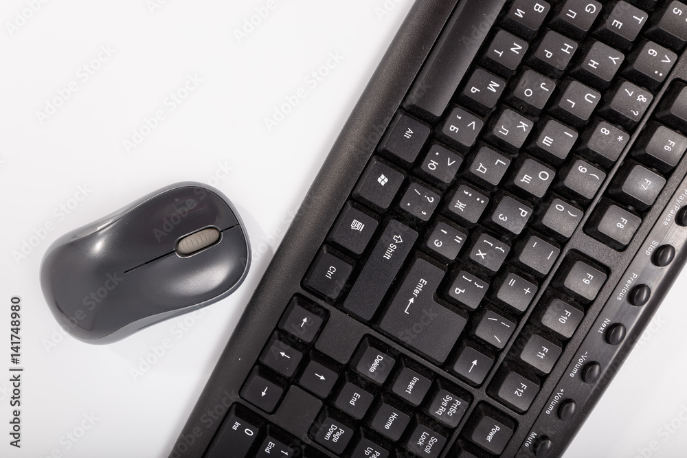 Black keyboard with a mouse on a white background. Isolate Black keyboard with a mouse on a white background. Isolate