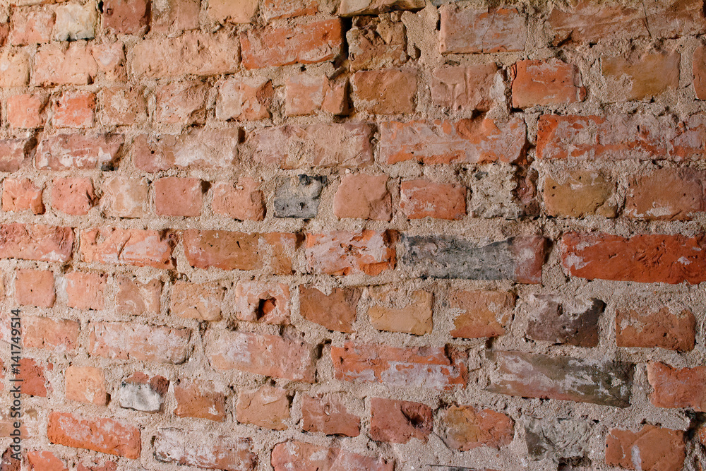 Angle view of old empty uneven raw brick wall Angle view of old empty uneven raw brick wall