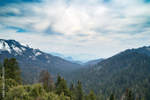 Landscape of Sequoia National park in spring with mountain peaks covered by snow