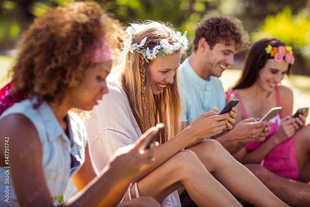 Group of friends using mobile phone Group of friends using mobile phone