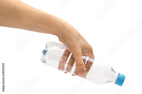 hand of young girl holding water bottle