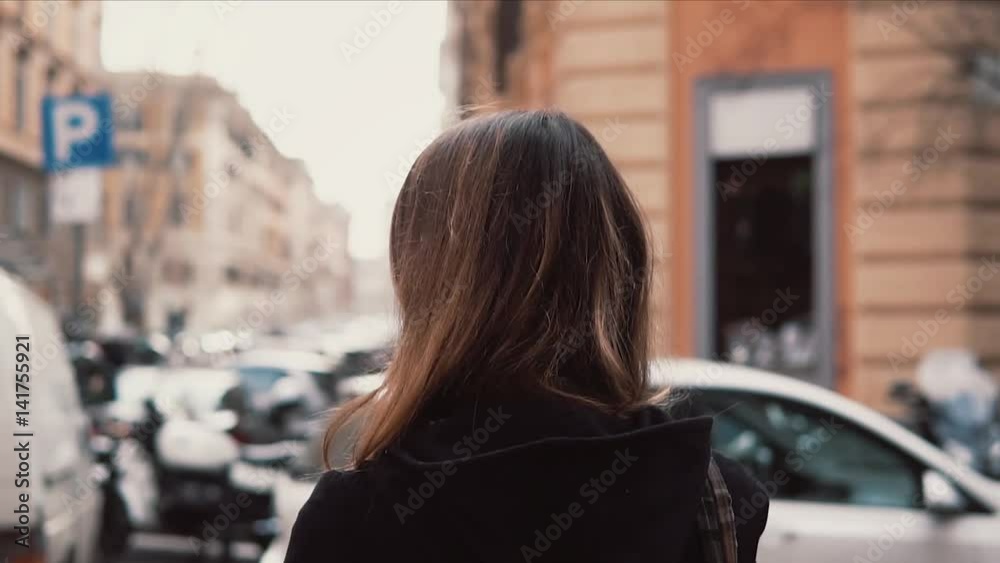 Confused girl looks around in the downtown. Tourist woman with backpack try find way, exploring new city. Slow motion. Confused girl looks around in the downtown. Tourist woman with backpack try find way, exploring new city. Slow motion.