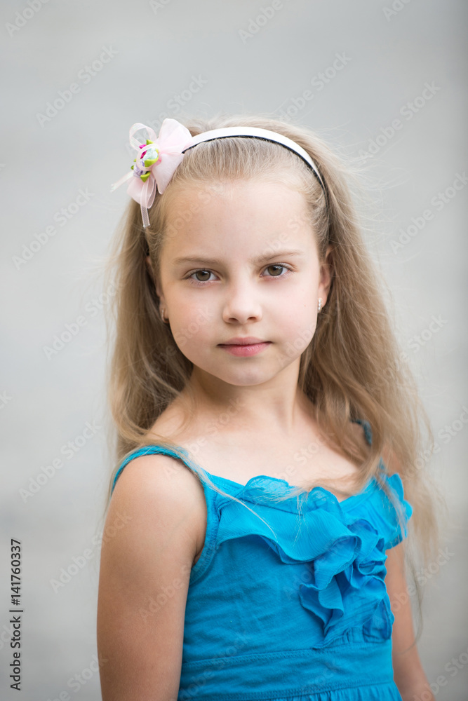 small baby girl with adorable face in blue vest outdoor small baby girl with adorable face in blue vest outdoor