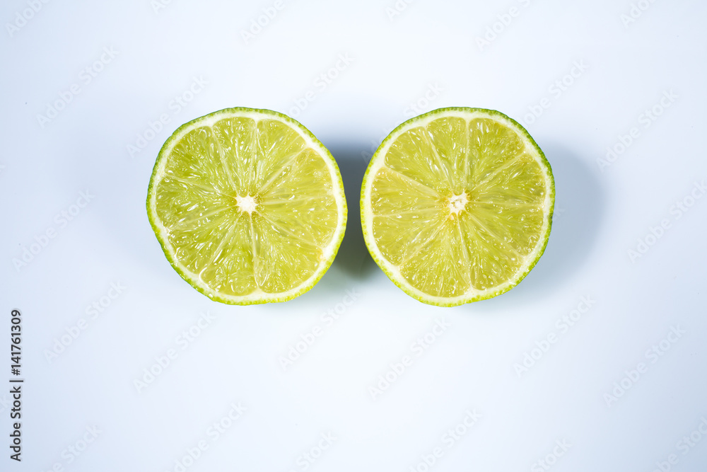 A lime sliced in half isolated on white background
