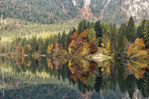 Italy, Trentino Alto Adige, Non valley, autumn reflections at Tovel Lake photo