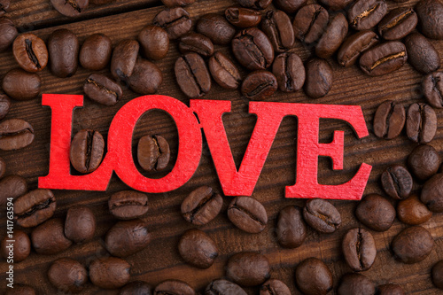 Coffee beans. Good morning. Roasted coffee beans background close up. Coffee beans pile from top with copy space for text. Coffee house.