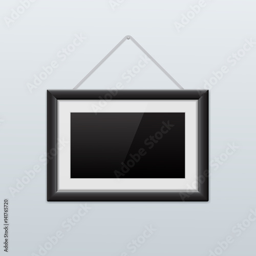 Picture frame hanging on the wall. Black icon