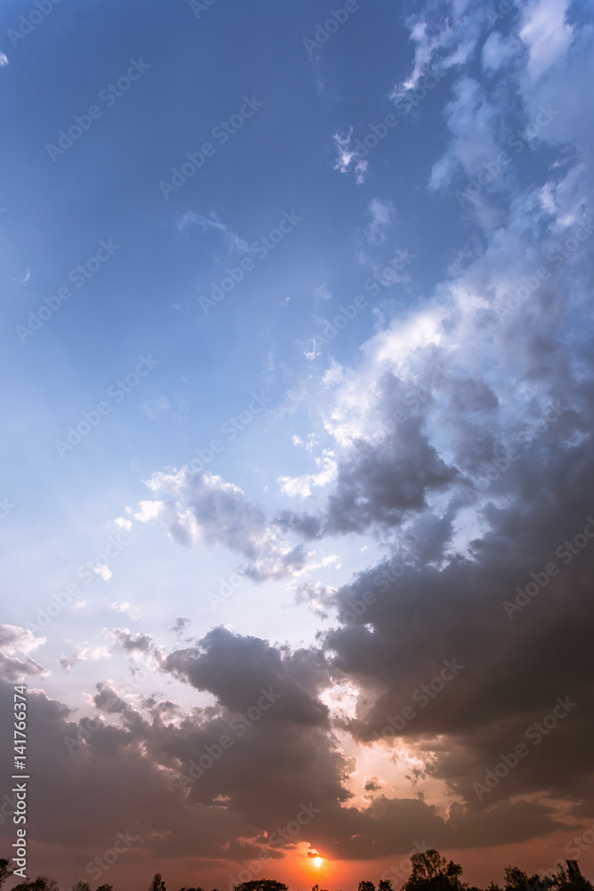 Colorful dramatic sky with cloud at sunset.Sky with sun background.
