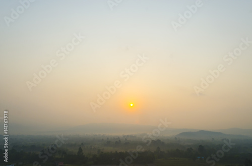 Sunrise over the hills that stretch with pavilion, Nakhonnayok Thailand photo