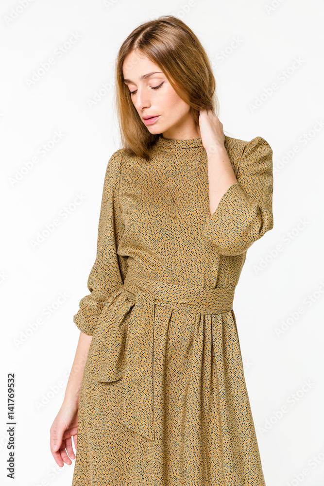 Young elegant female in light summer dress, over white background Young elegant female in light summer dress, over white background