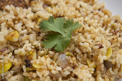 cooked integral rice with vegetables, closeup