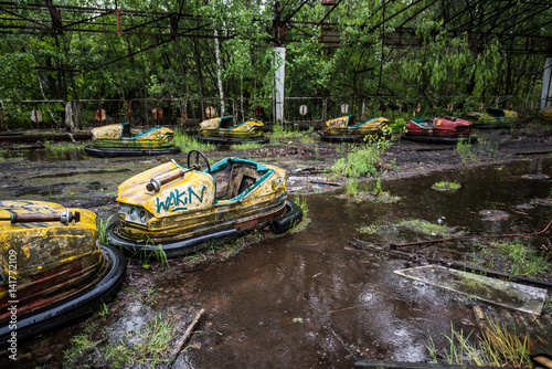 abandoned cars in Pripyat park, Chernobyl, Ukraine photo