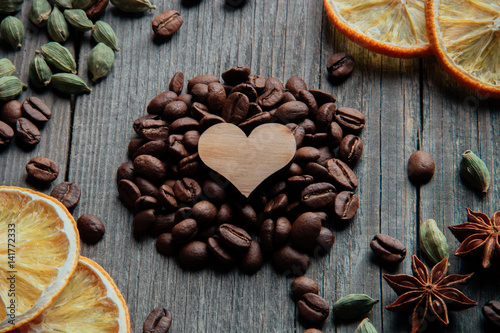 Coffee beans and a wooden heart close-up