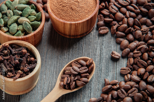 Coffee beans on a wooden background close-up