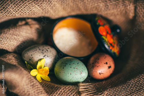 easter eggs on the rustic sackcloth background