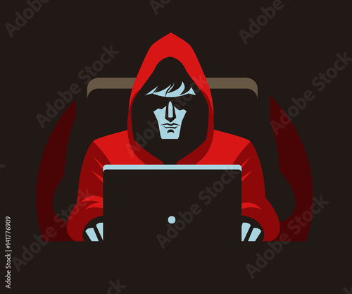 hacker stalker using a computer in the darkness