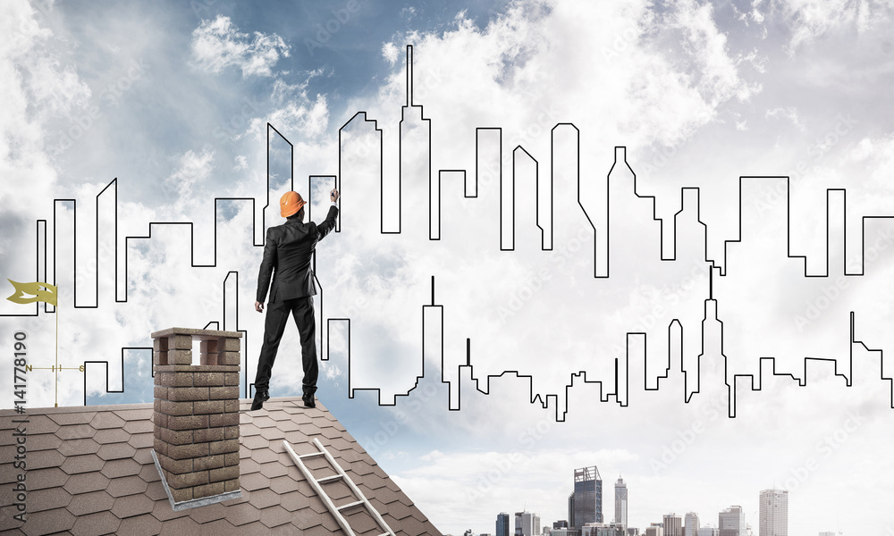 Man architect draw silhouette of modern city on blue sky. Mixed Man architect draw silhouette of modern city on blue sky. Mixed