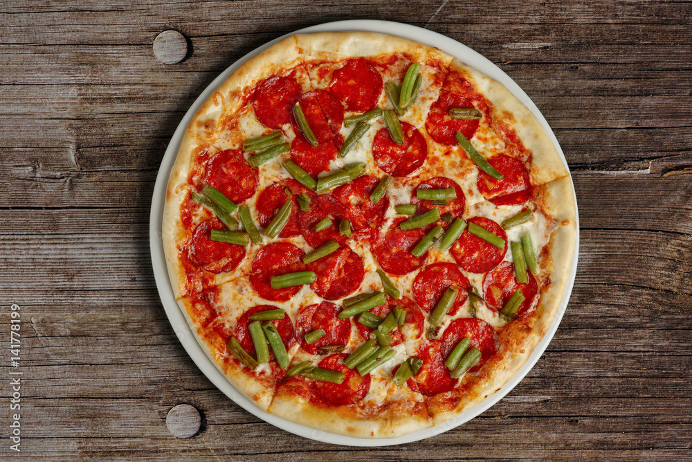 top view of pizza pepperoni on wooden background top view of pizza pepperoni on wooden background