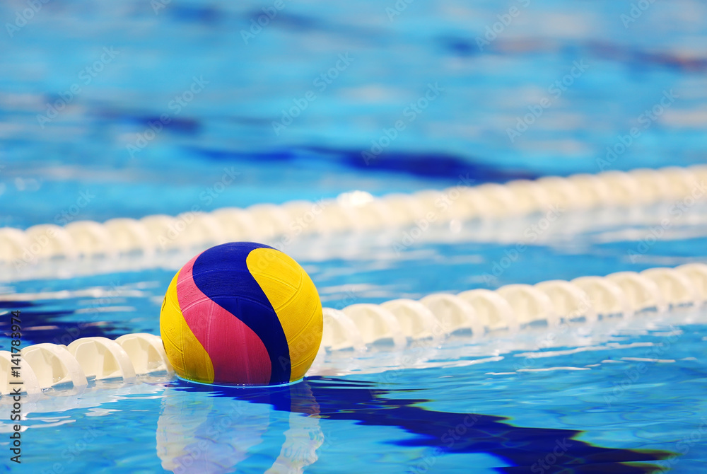 Colorful water ball in swimming-pool