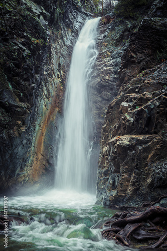 Mountain waterfall at fall