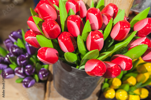 Photography Colorful wooden tulips stand in small bucket