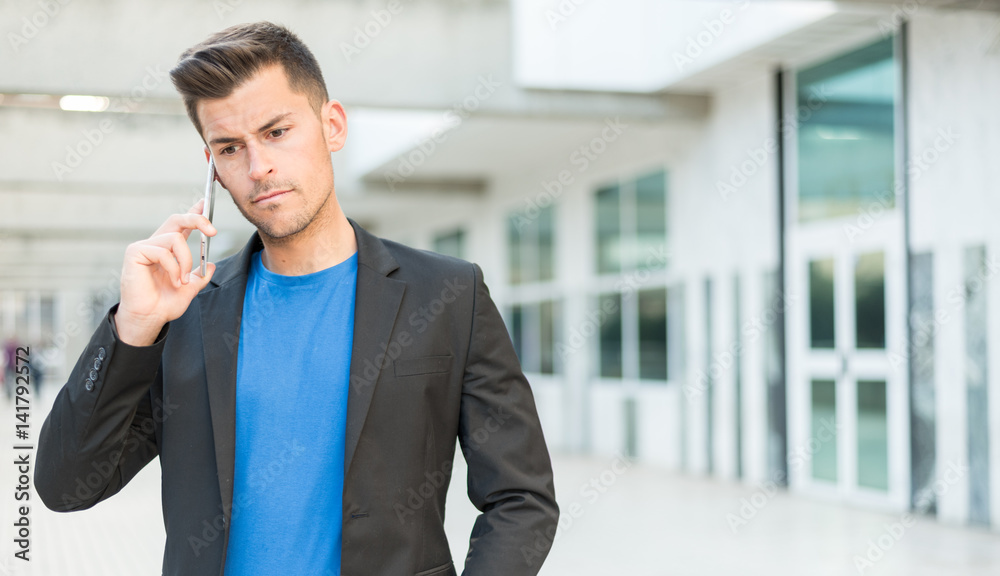 upset man talking on mobile phone upset man talking on mobile phone