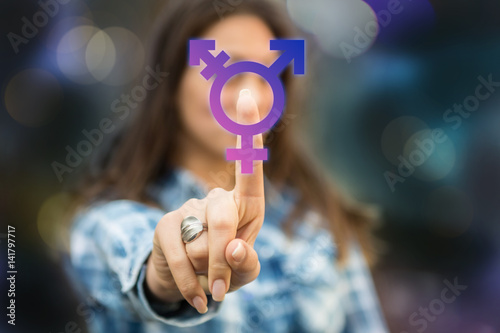 Person pressing transgender symbol on touch screen. LGBT right concept. Transgender person coming forward about sexuality orientation.