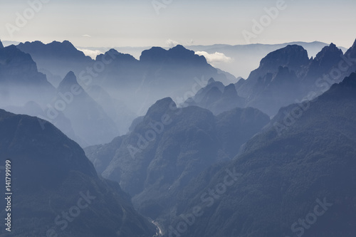 Succession of peaks southward, view from Second Pala di San Lucano. Dolomites, Agordino, Belluno, Veneto, Italy, Europe photo