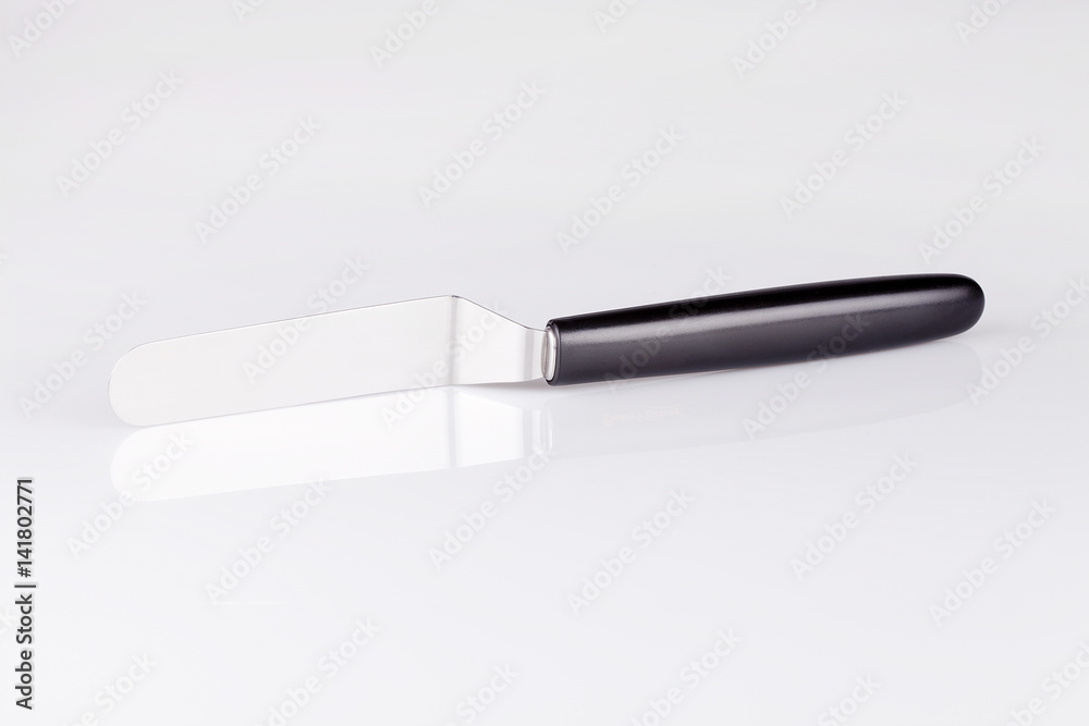 Pancake spatula / cake spatula on shite surface. Isolated on white background. Pancake spatula / cake spatula on shite surface. Isolated on white background.