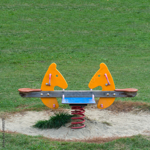 Double seats spring Horse in the meadow  of a Playground