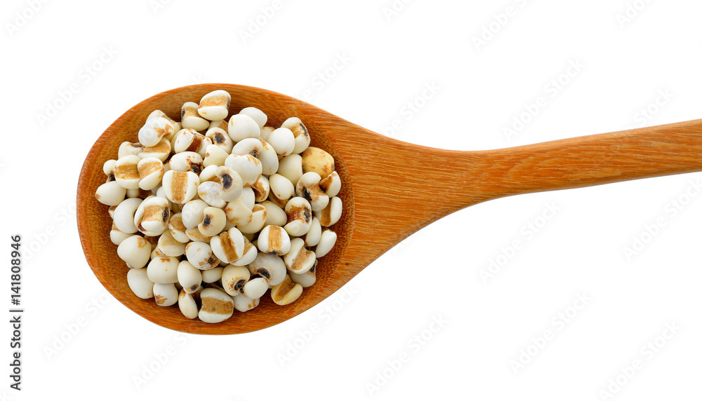 Millet in wood spoon isolated on white background Millet in wood spoon isolated on white background