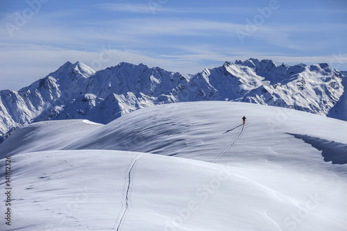 Mountaineering on the Dosso Liscio mountain, in the background the Orobie alps, Lombardy, Italy photo