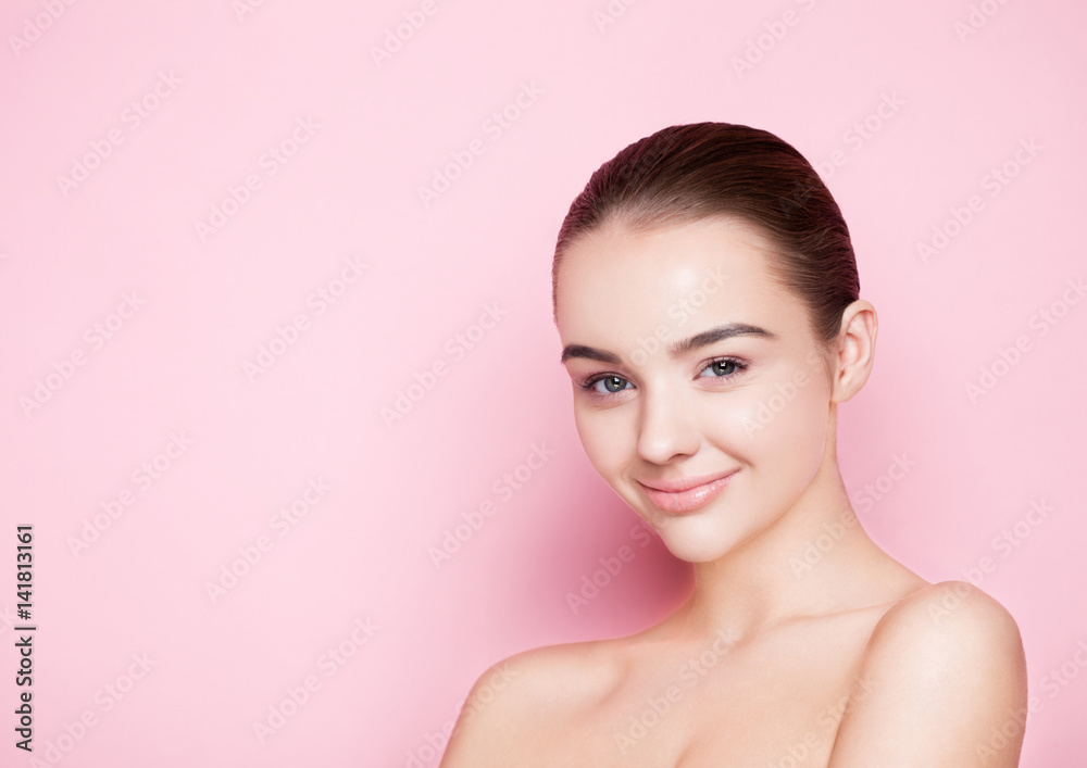 Beauty girl natural makeup with cute smile on pink Beauty girl natural makeup with cute smile on pink