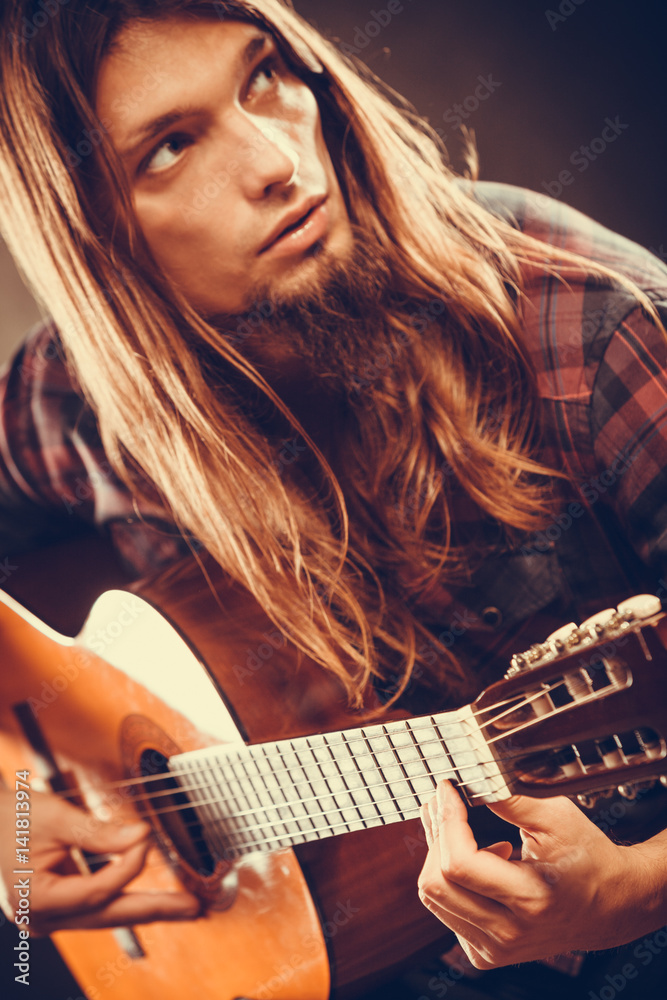 Naklejka premium Guitarist is playing the guitar.