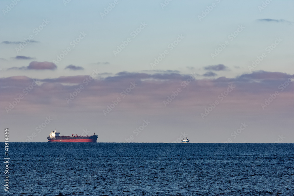 Cargo ship anchored far in the Baltic sea. Europe