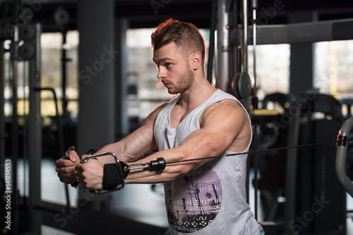 Young Man Exercising Chest In The Gym © Jale Ibrak