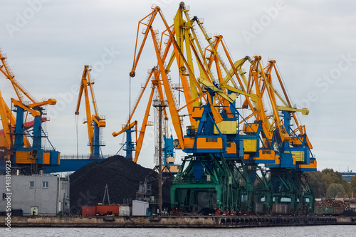 Yellow cargo cranes in the port of Riga  Europe