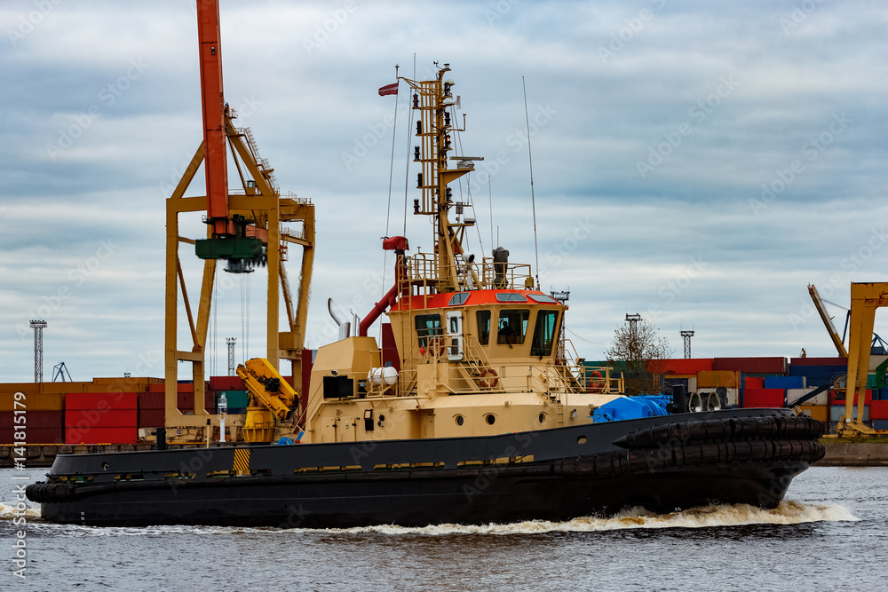 Tug ship in the cargo port of Riga, Europe