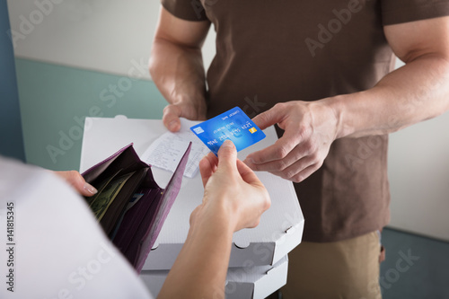 Woman Using Credit Card For Payment