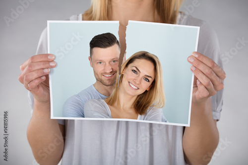 Woman Tearing Photo