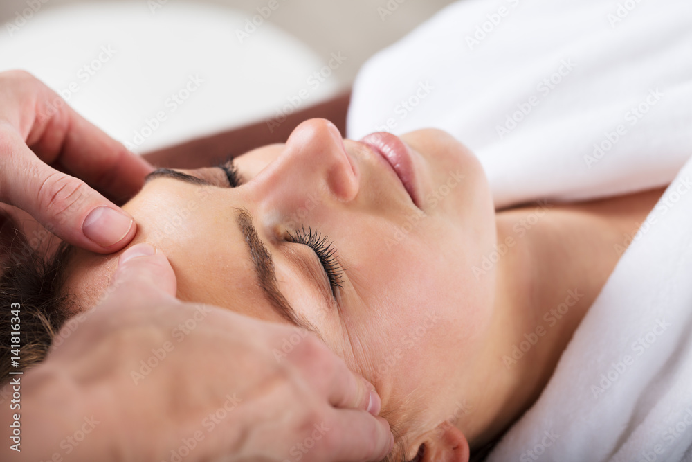 Therapist Giving Massage On Woman's Forehead Therapist Giving Massage On Woman's Forehead