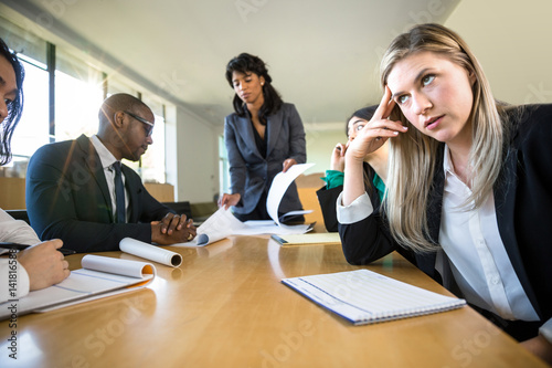 Bored aloof corporate female business executive passionless unexcited and unprofessional photo