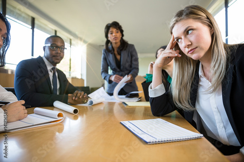 Photography Unfocused unenthusiastic bored coworker at business meeting indifferent and apat