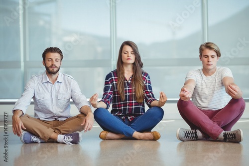 Executives practicing yoga