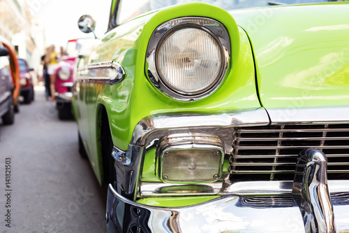 Photography Concept of Cuba attractions. Headlight of old car in Havana, Cuba