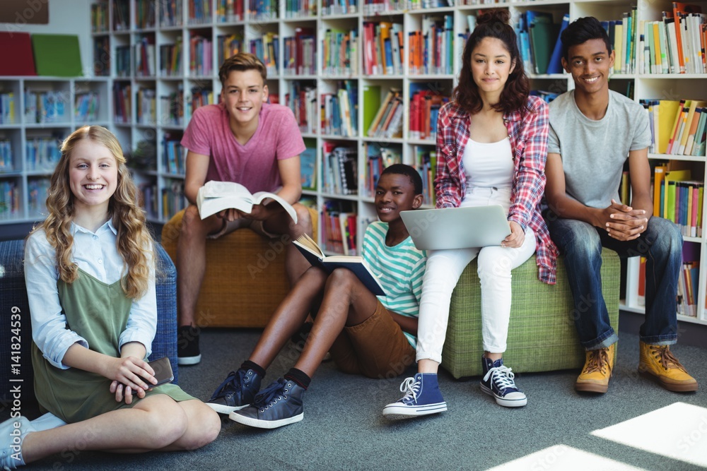 Obraz premium Portrait of happy students in library