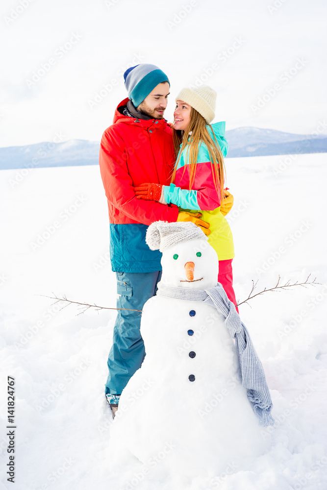 Happy couple outdoors in winter
