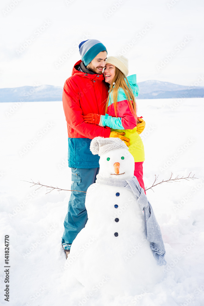 Happy couple outdoors in winter