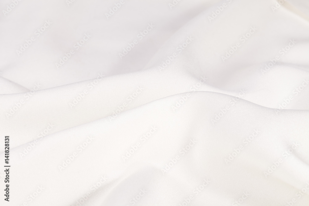 Silk background, texture of white shiny fabric