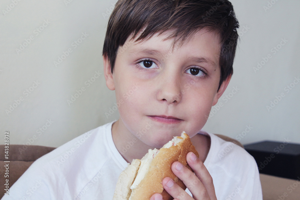 Boy eats white bread Stock Photo Adobe Stock